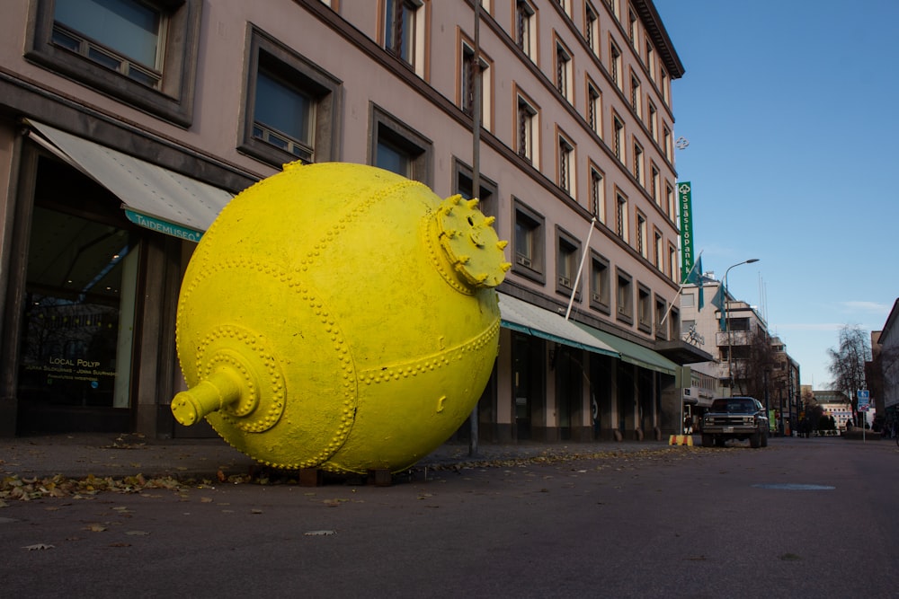 huge yellow ball on street