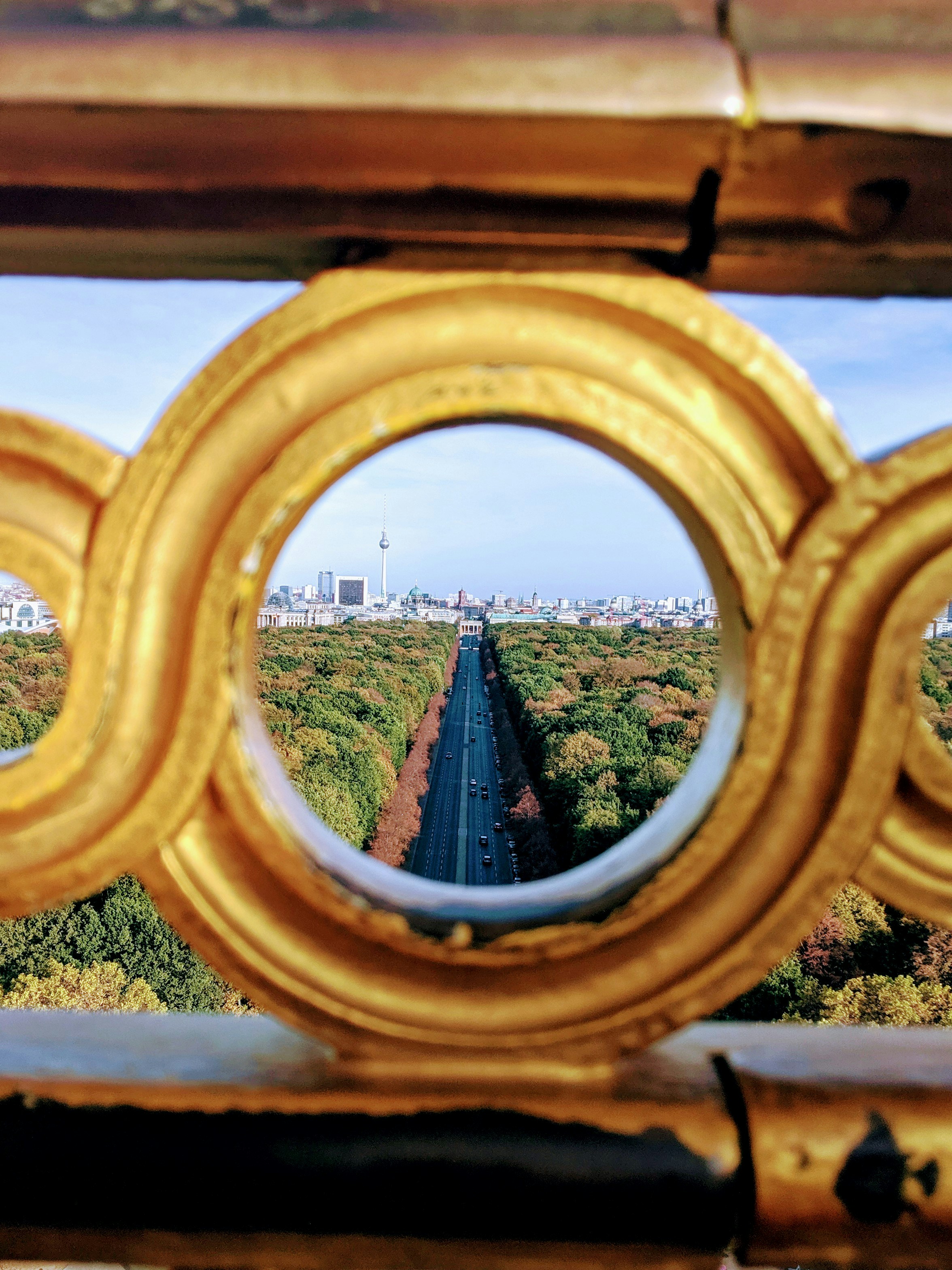 concrete highway overlooking through gold round railings
