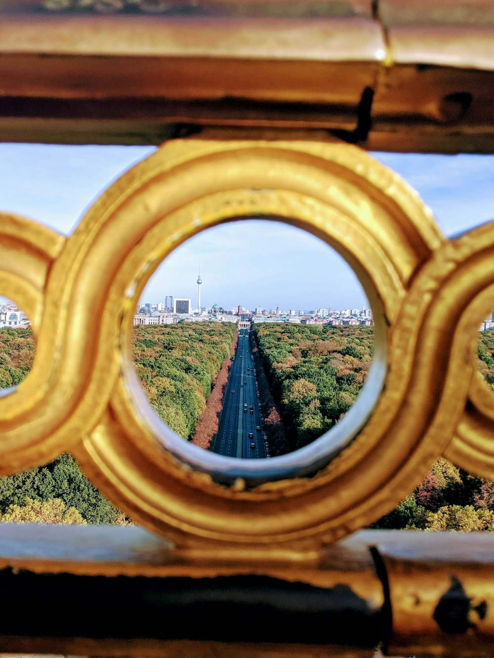 concrete highway overlooking through gold round railings