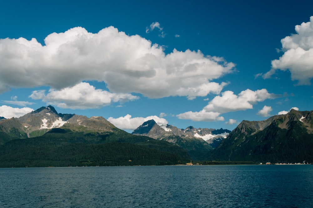 gray rocky mountain under cloudy sky during daytime