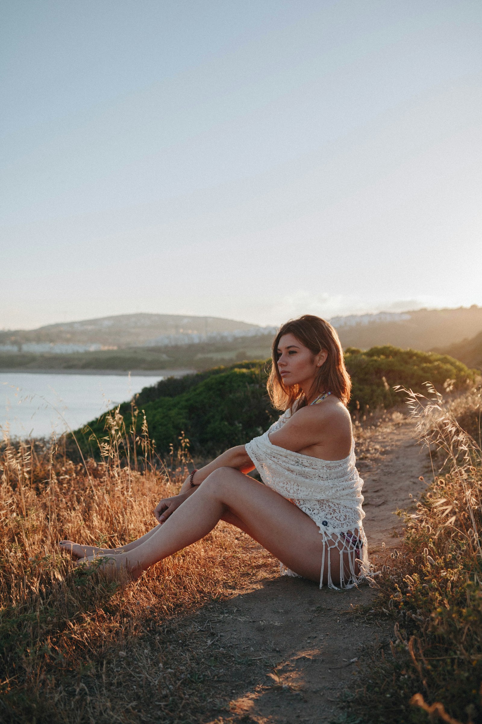 Sigma 18-35mm f/1.8 DC HSM sample photo. Woman sitting near river photography