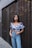 woman leaning on wall