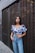 woman leaning on wall
