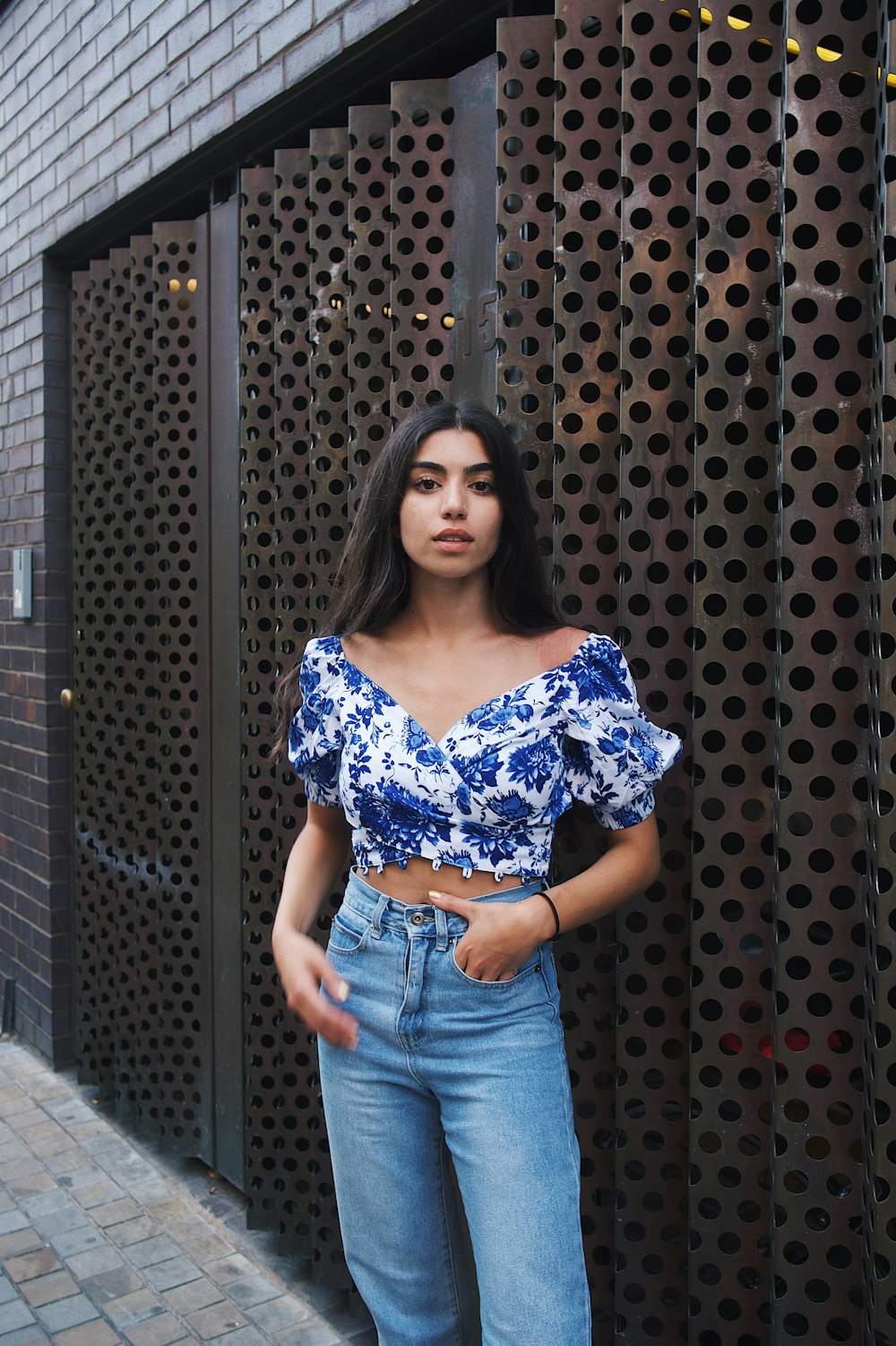 woman leaning on wall