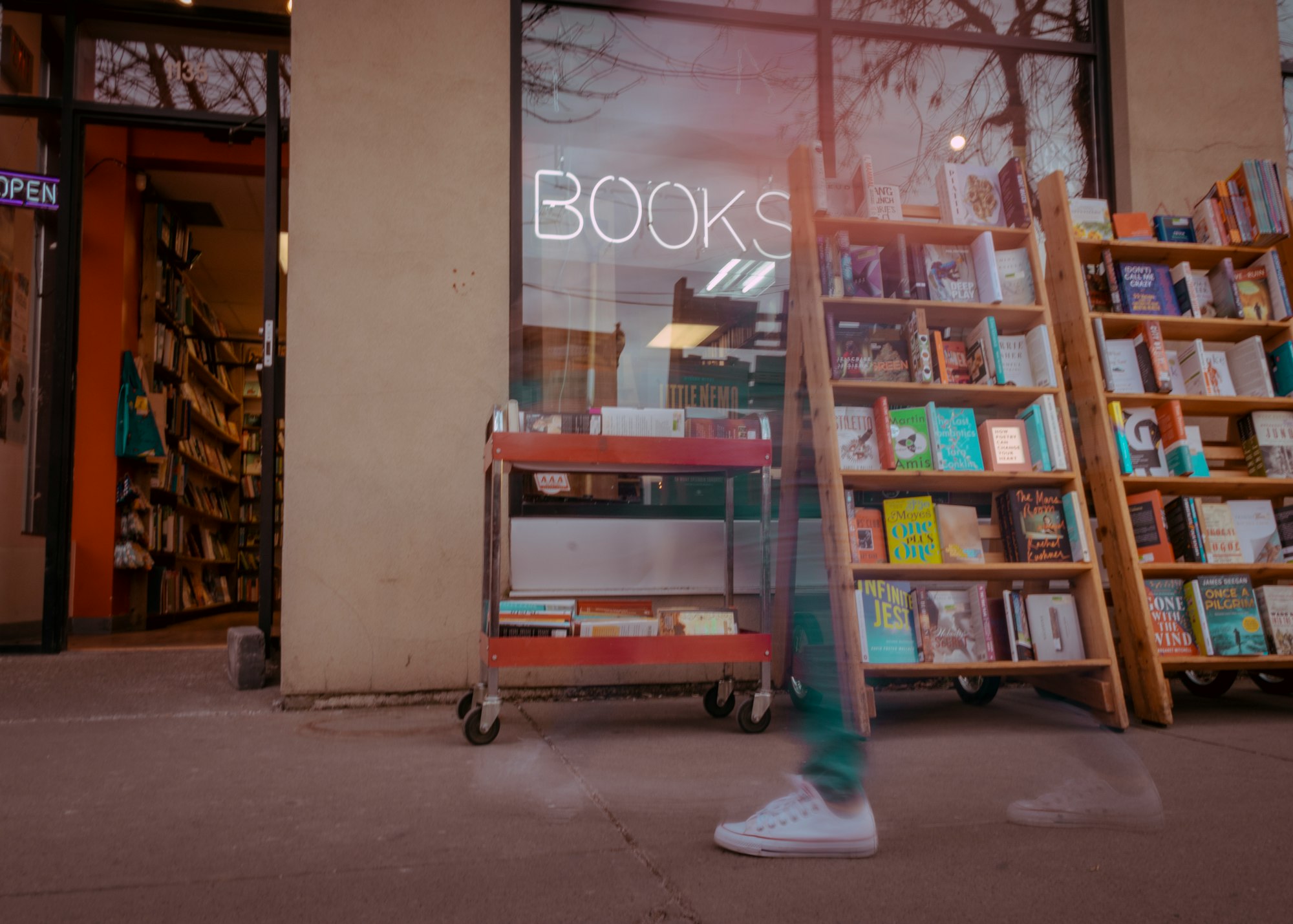 books on leaning shelves