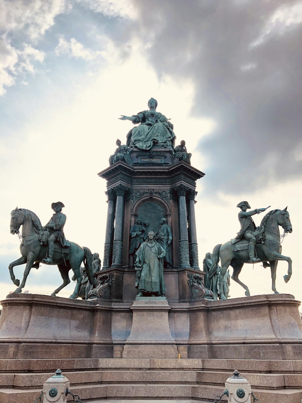 shallow focus photo of man riding horse statue