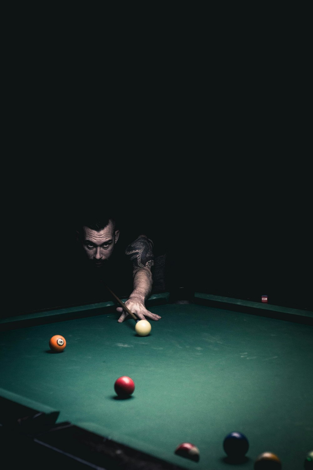 person playing billiard