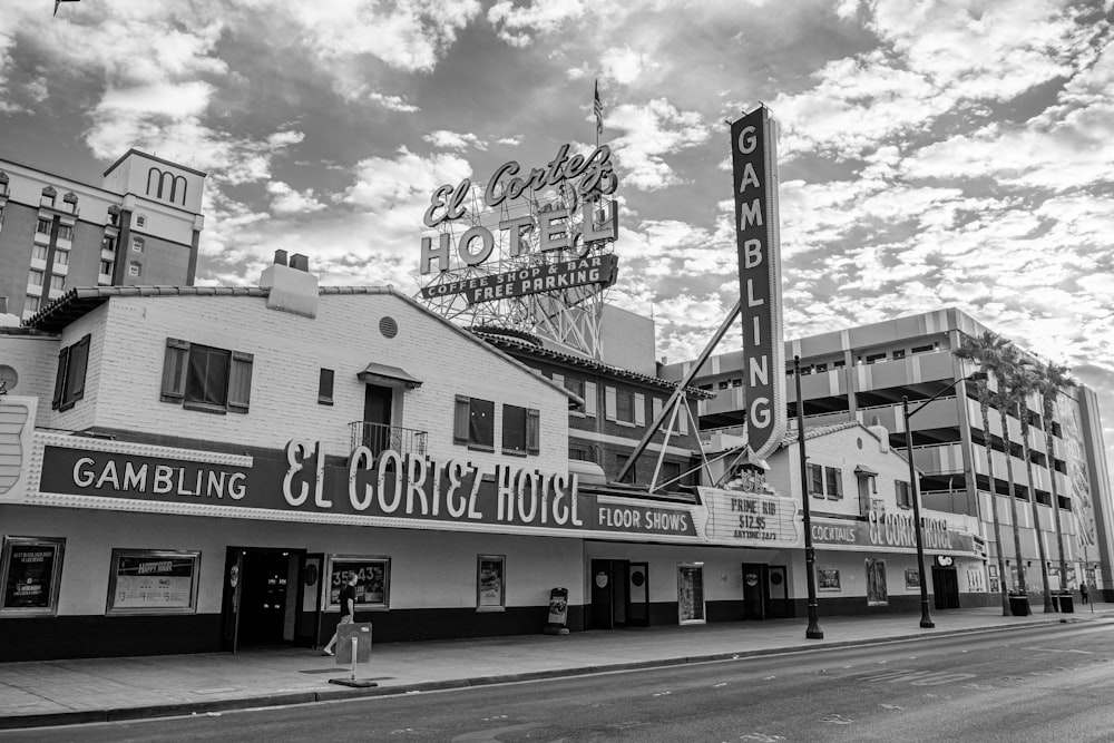 grayscale photography of El Cortez hotel beside road way