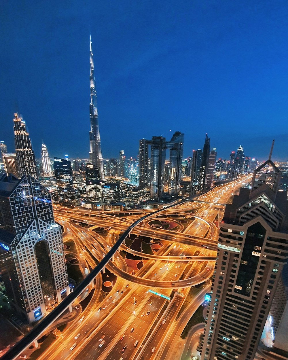 time lapse photography of vehicles passing by urban city streets