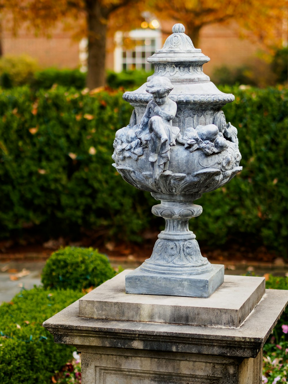 footed gray urn