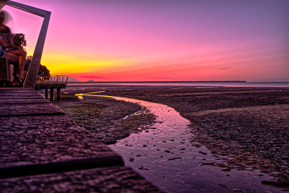 Cairns marina and waterfront glowing at tropical sunset