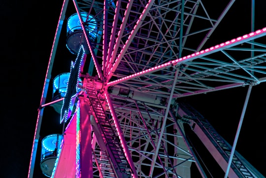 ferris wheel with lights at nighttime in Cairns City QLD Australia