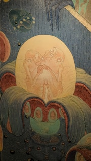 Close-up of Salvador Dalí's 'La Naissance Intra-Utérine' revealing intricate surreal details.