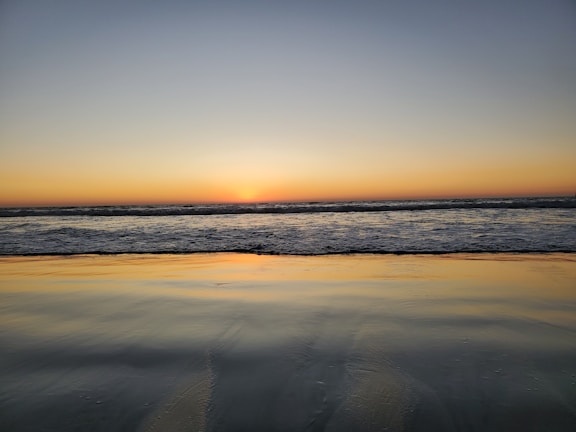 A beautiful sunset captured over a serene beach.