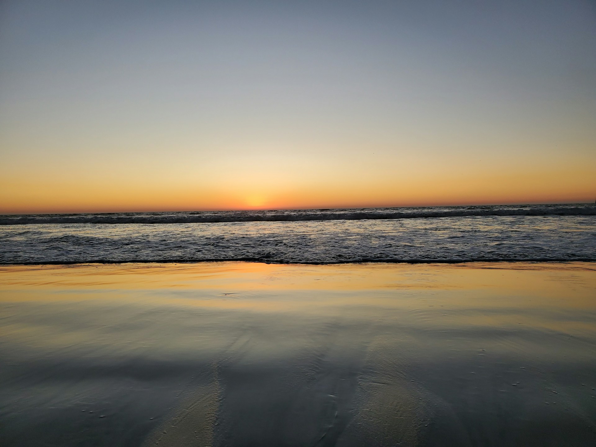 A beautiful sunset over a serene beach, capturing the essence of relaxation.