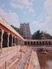 brown concrete building with waters between
