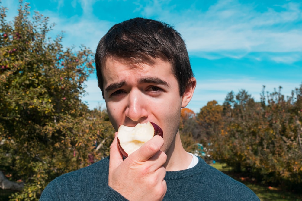 man eating apple