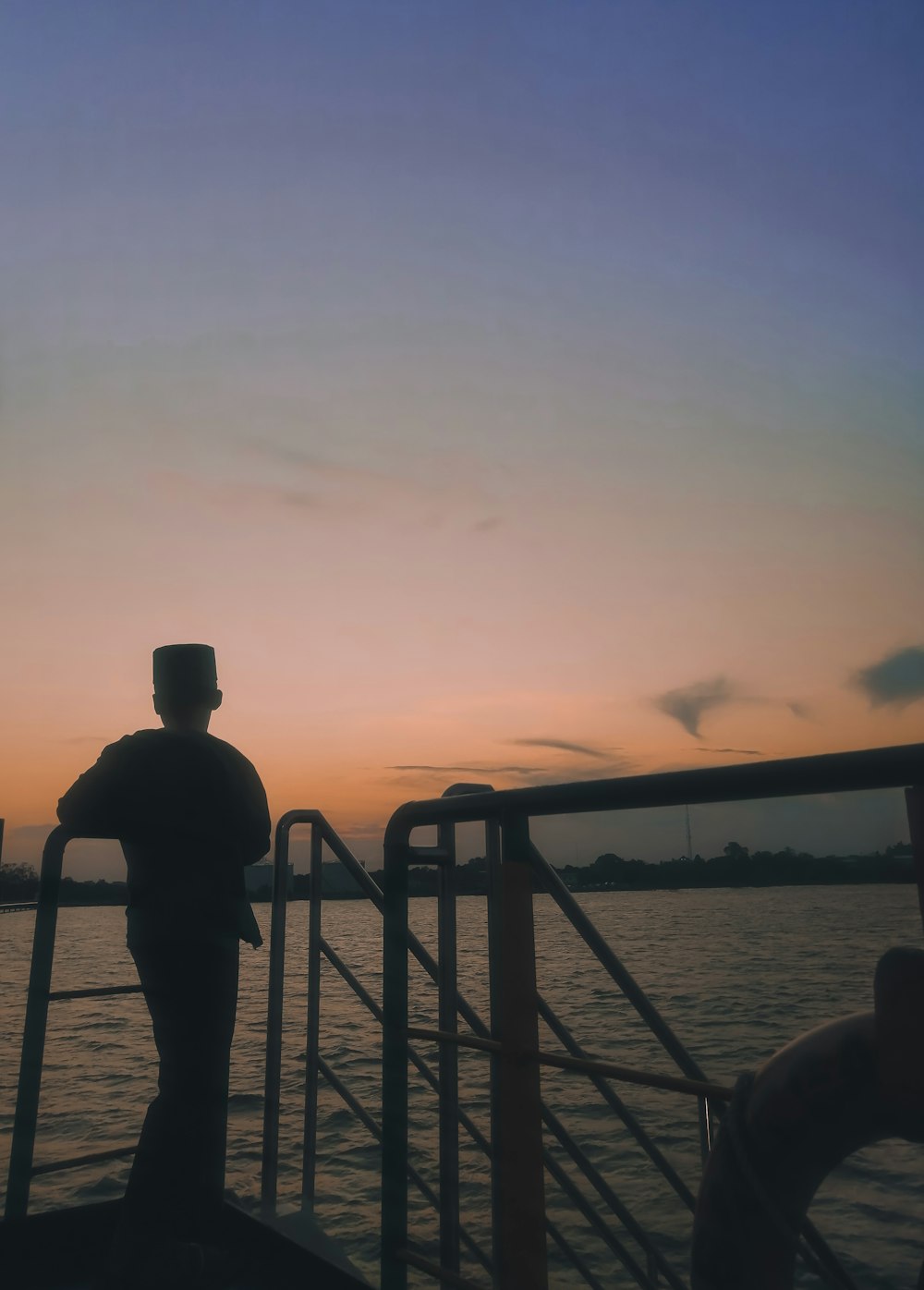 boy standing on the boat