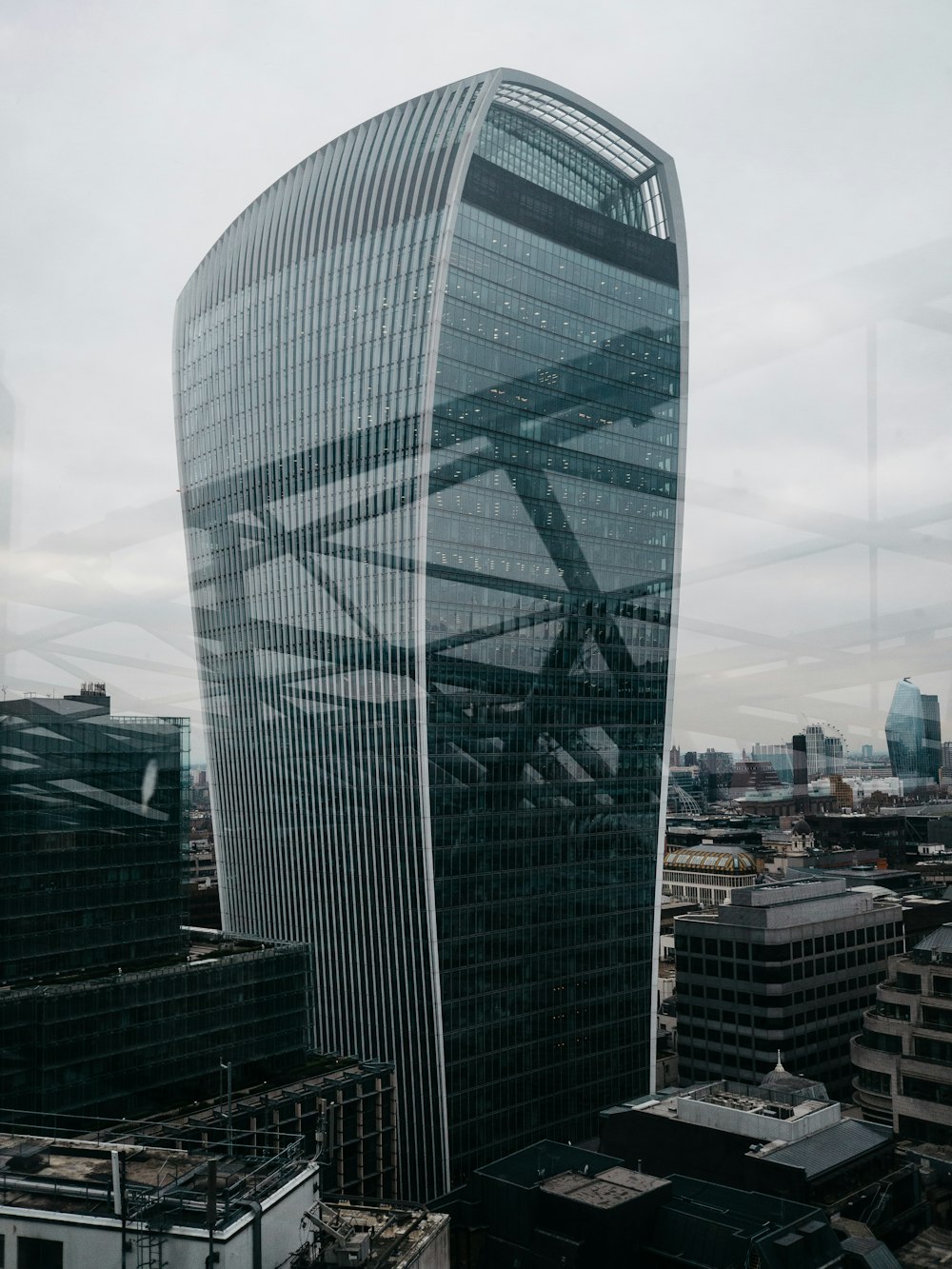 black and gray concrete tower beside buildings