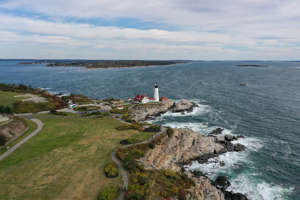 aerial photography of lighthouse by the sea