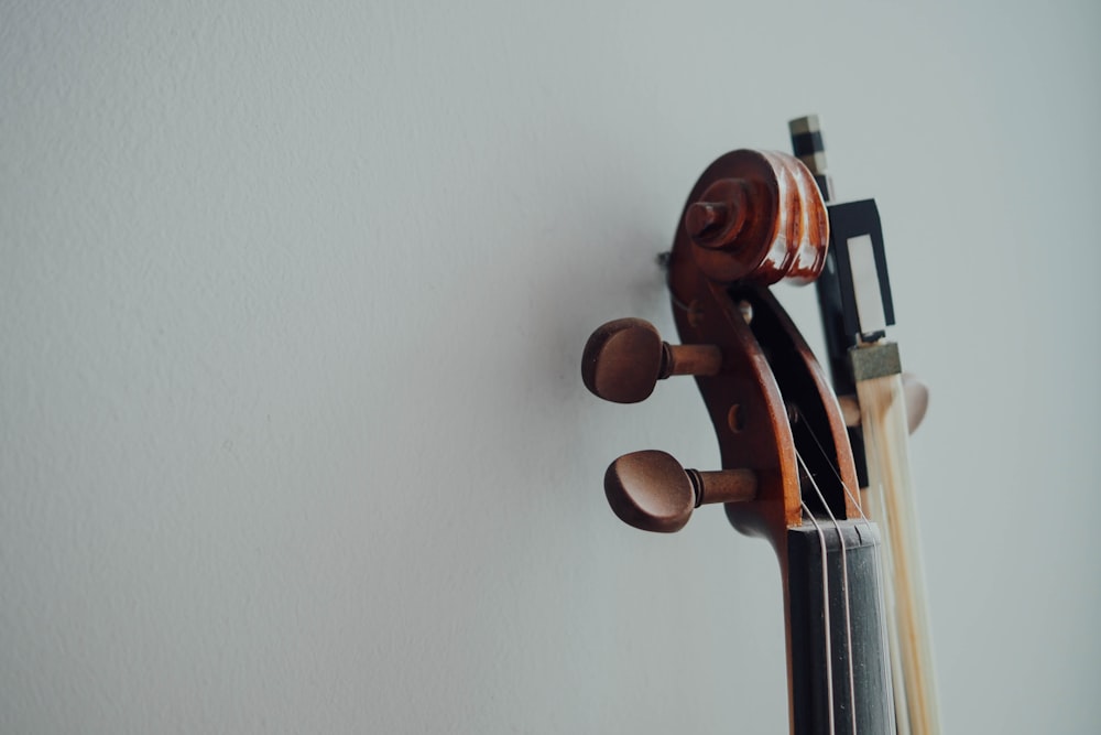 brown wooden stringed instrument headstock
