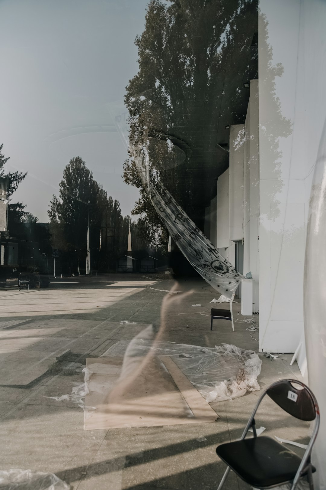 two chairs in the sidewalk