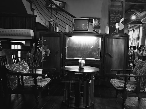 grayscale photography of TV hutch