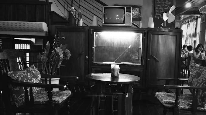 grayscale photography of TV hutch