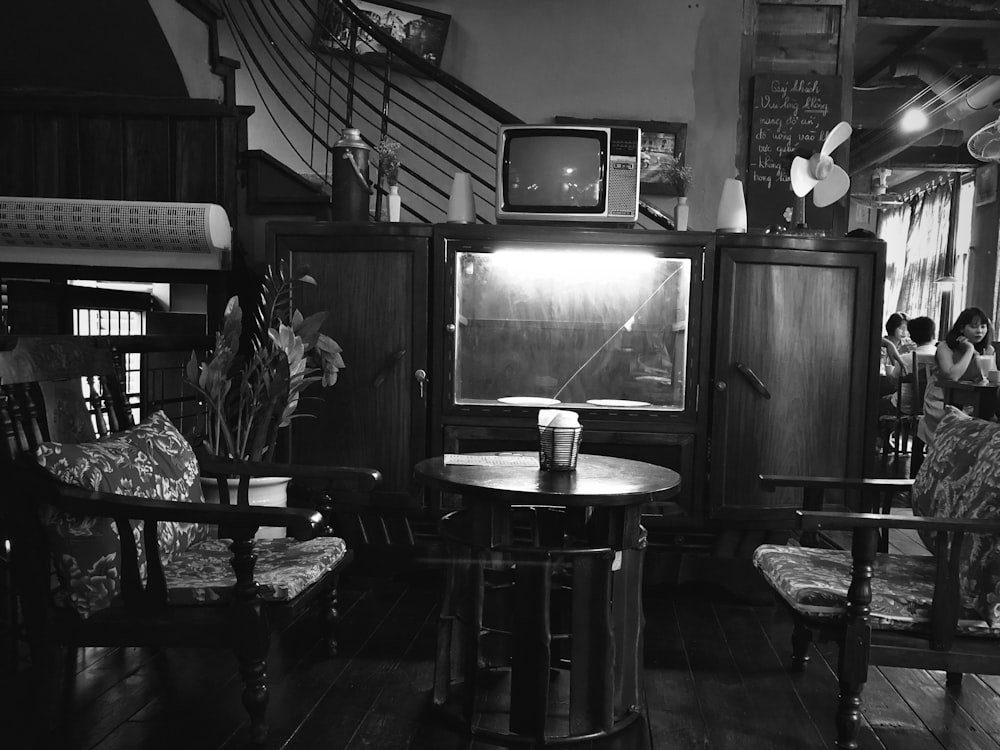 grayscale photography of TV hutch