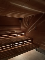 A close-up of steam rising from a hot sauna, creating a calming atmosphere.