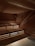 A warm, inviting sauna interior glowing softly with wooden benches and gentle lighting.