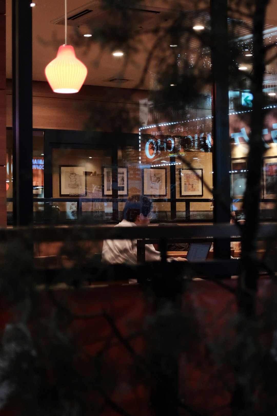 man sitting inside a restaurant
