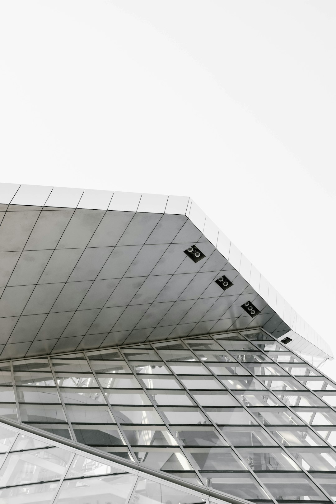 low-angle photography of white concrete buildings under a clear sky