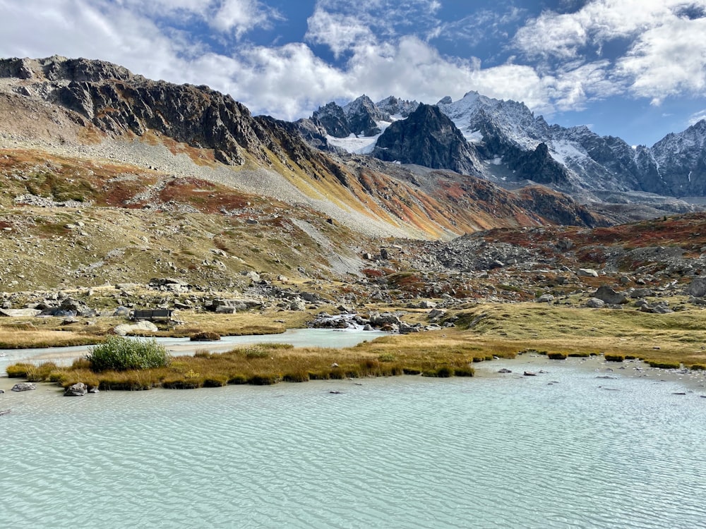 mountain ranges beside body of water