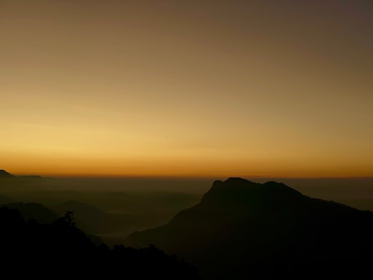 golden hour under brown mountain ranges in Dhampus Nepal