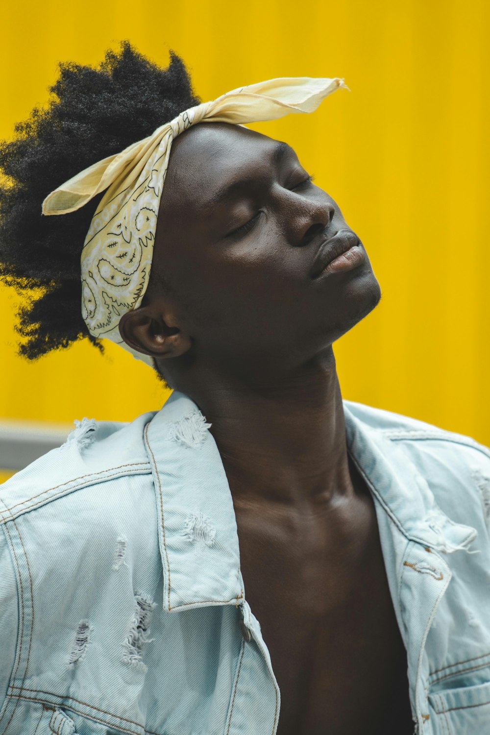 man wearing distressed white denim jacket