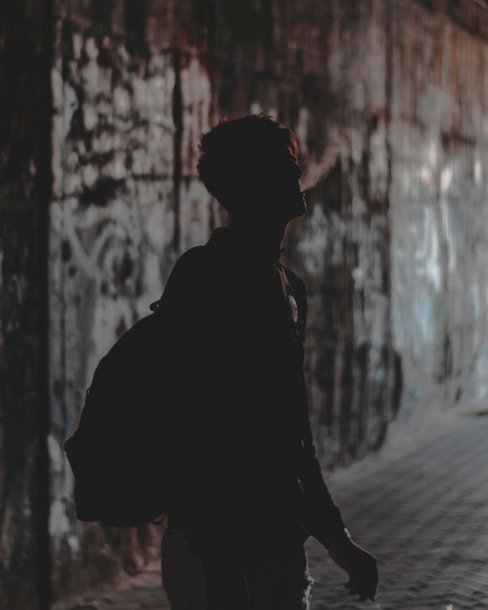 silhouette of a man smoking