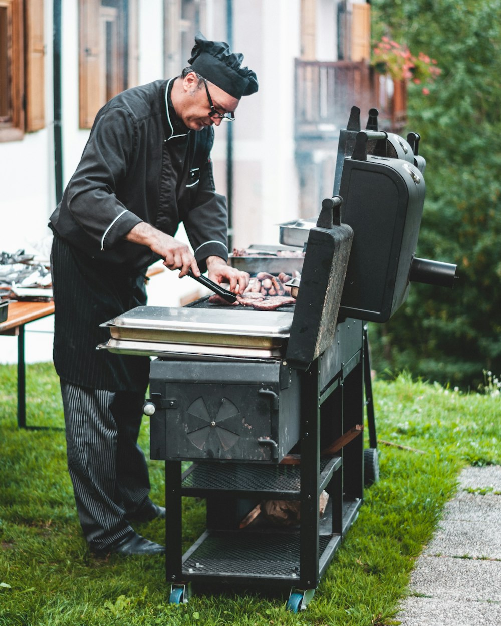 man grilling meat