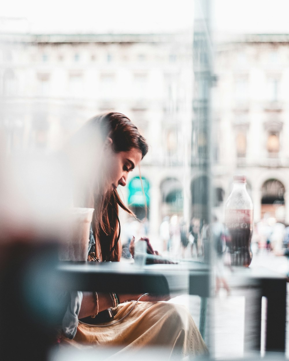 woman sitting beside table