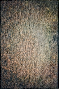 Close-up of fabric textures in earthy green and blue tones reminiscent of Galicia.