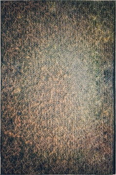 Close-up of textured fabric in earthy tones, showcasing quality.