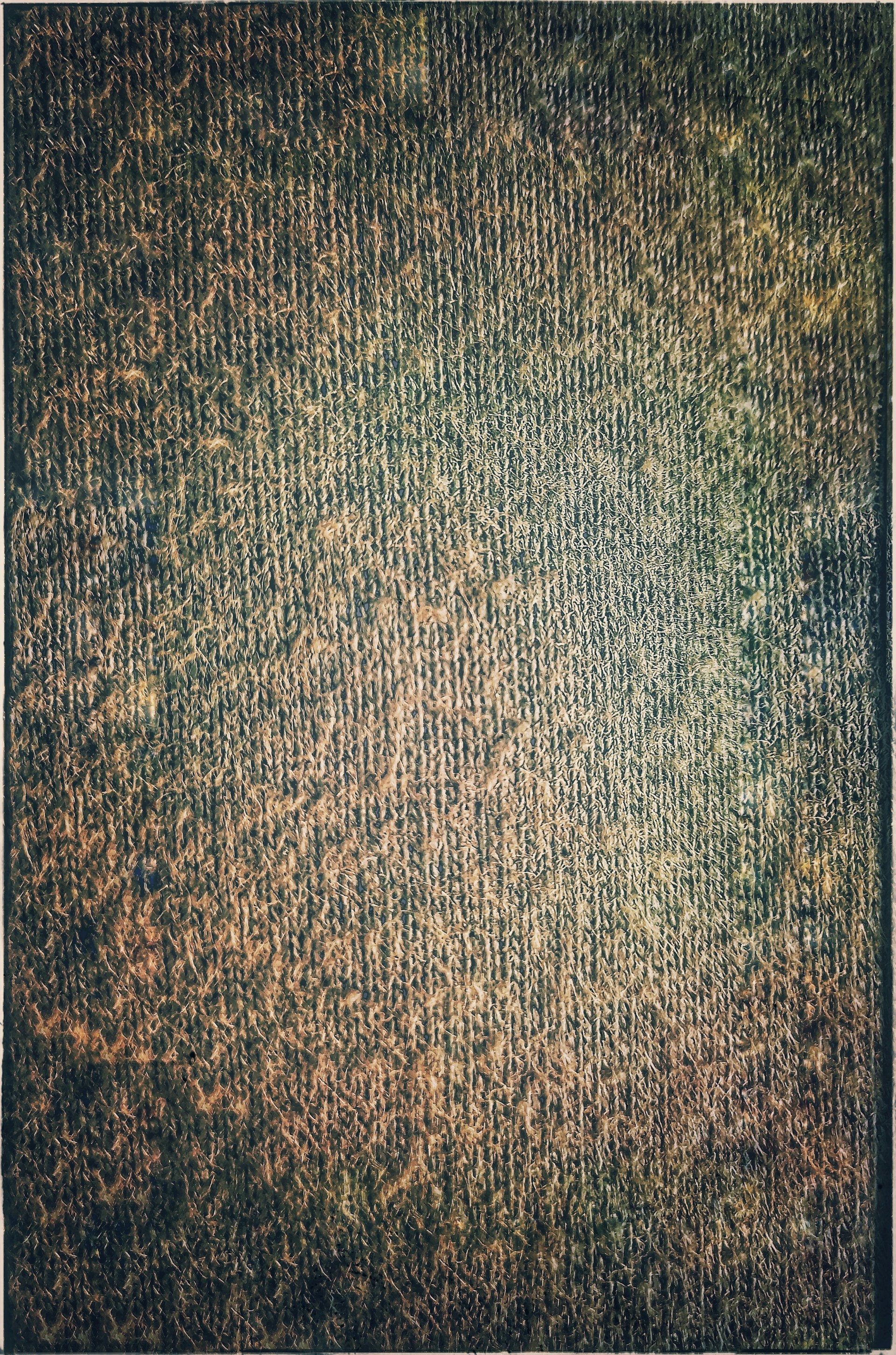 Close-up of textured fabrics in muted earth tones, showcasing the fine details and craftsmanship of the collection.