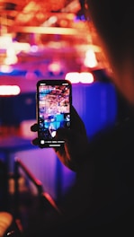 person taking a picture using a smartphone