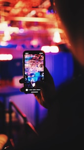 person taking a picture using a smartphone