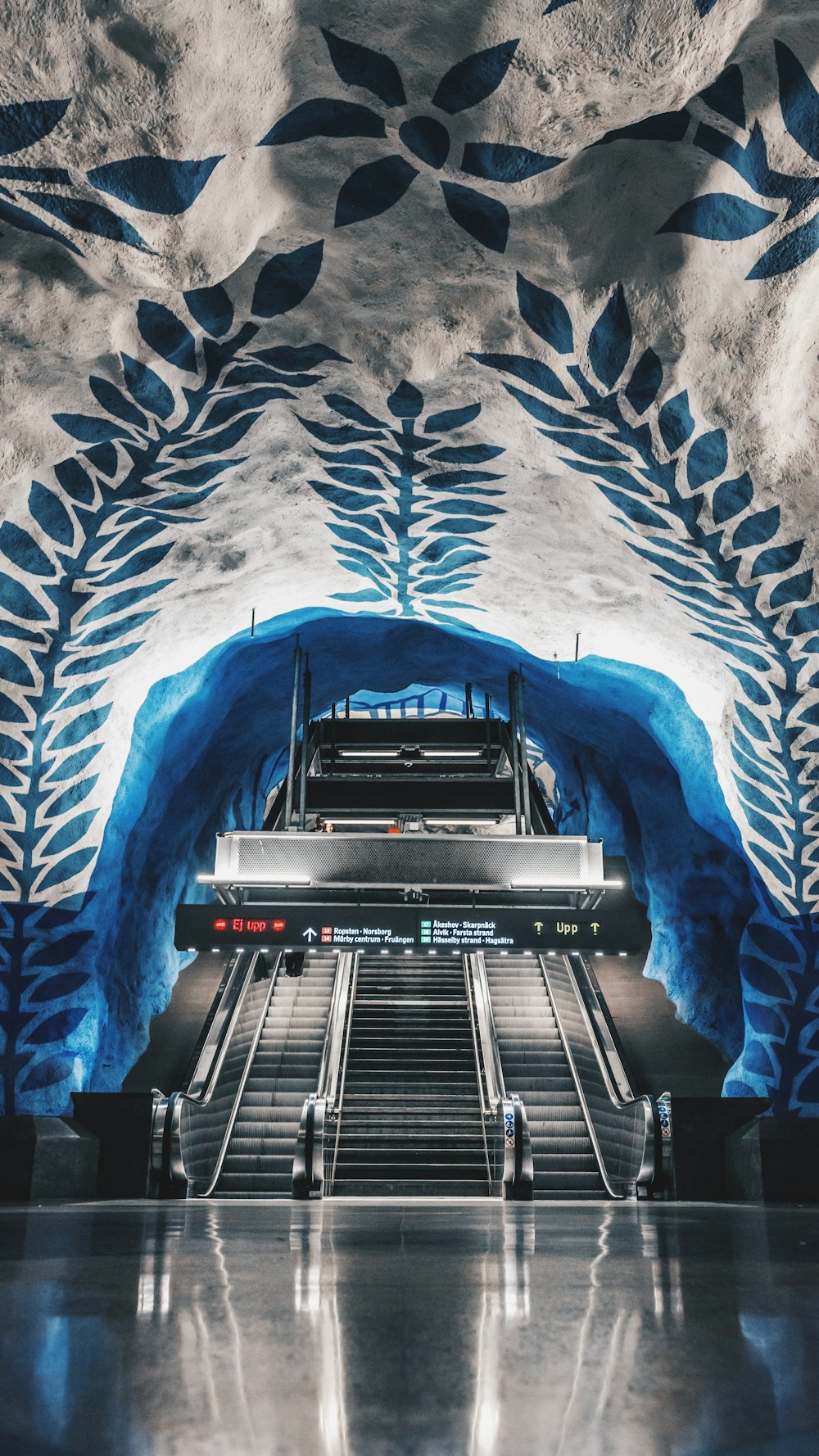 grey escalator inside building