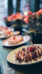 chocolate waffle and pink strawberry on plate