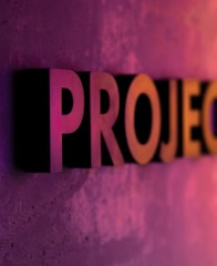 Projects text on pink and orange