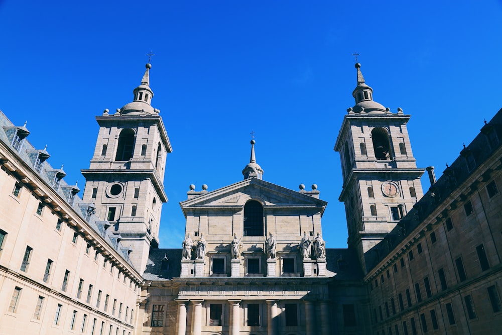 a large building with two towers and a clock