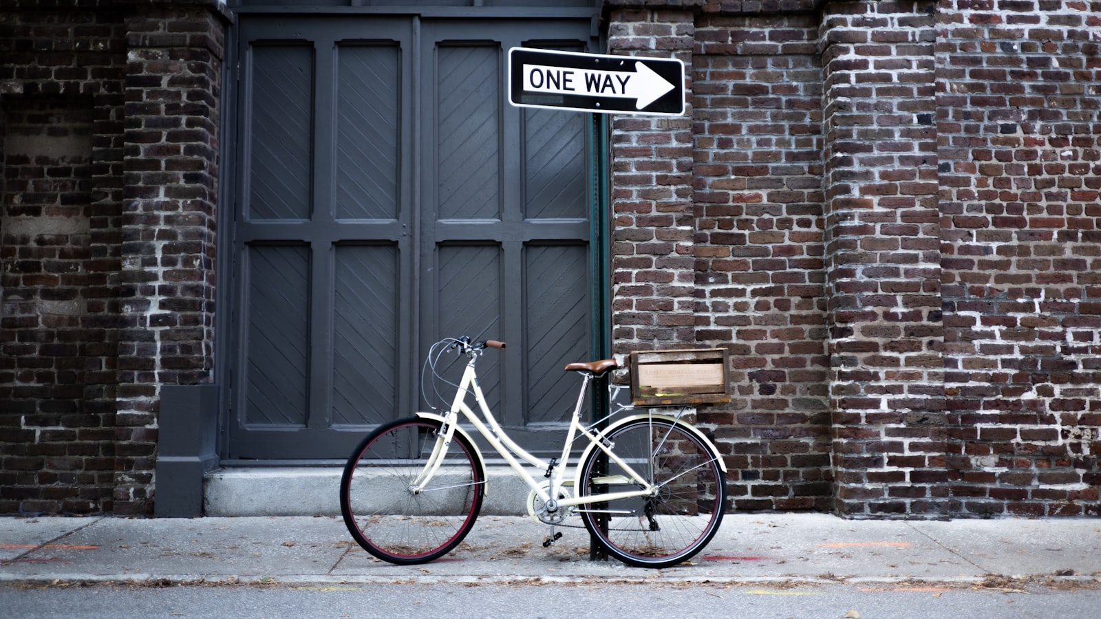 ZEISS Loxia 35mm F2 sample photo. Bicycle parked outside a photography