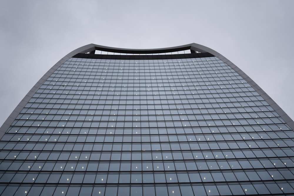low angle photography of clear glass walled building